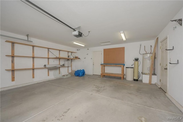 garage featuring secured water heater and a garage door opener