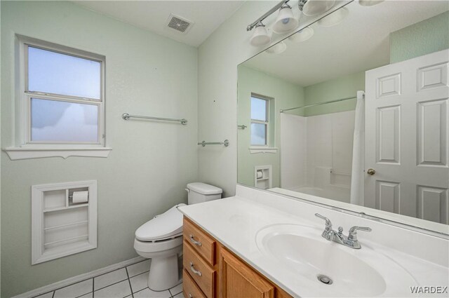 full bathroom featuring a shower, visible vents, toilet, vanity, and tile patterned flooring