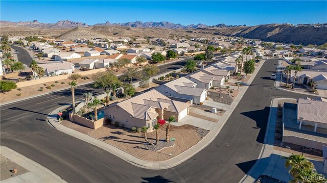 birds eye view of property with a residential view and a mountain view