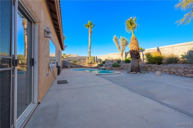 view of patio with a fenced backyard and a fenced in pool