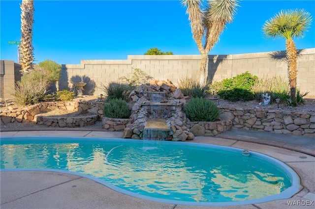 view of pool featuring a fenced backyard and a fenced in pool