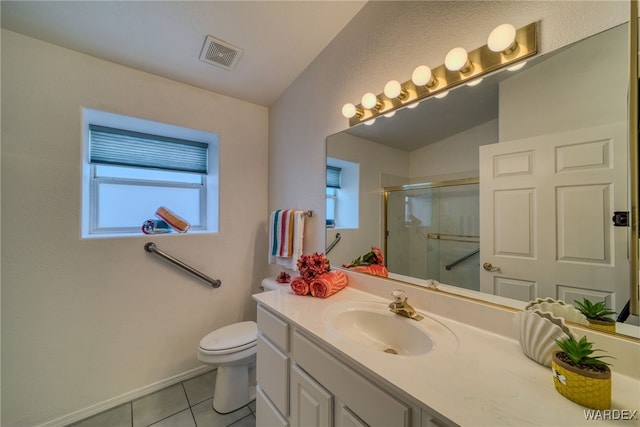 bathroom featuring tile patterned floors, visible vents, toilet, a shower stall, and vanity