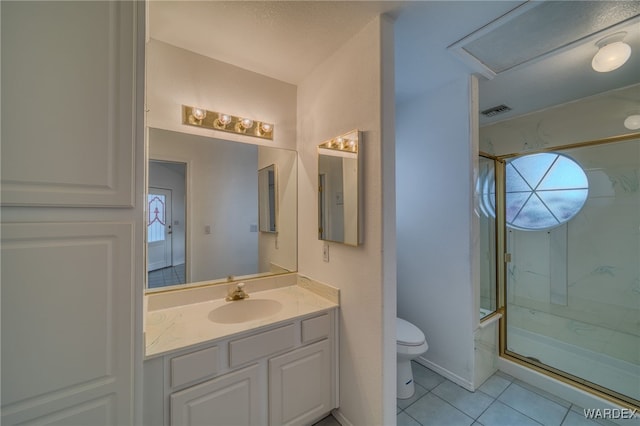 full bathroom featuring a marble finish shower, visible vents, toilet, tile patterned floors, and vanity