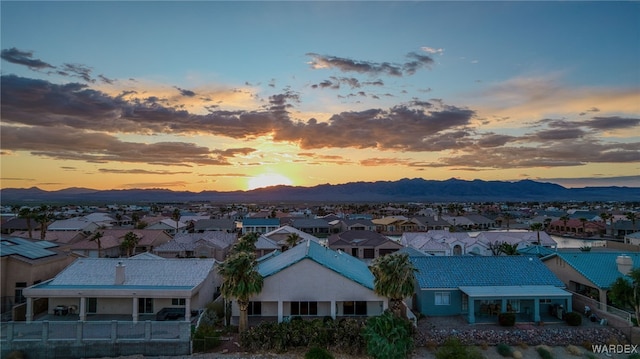 aerial view at dusk with a residential view and a mountain view