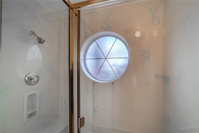 full bath featuring a marble finish shower