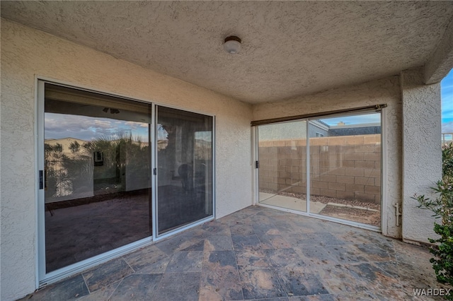 view of patio / terrace featuring fence