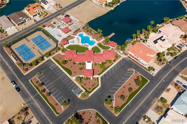 drone / aerial view with a residential view and a water view