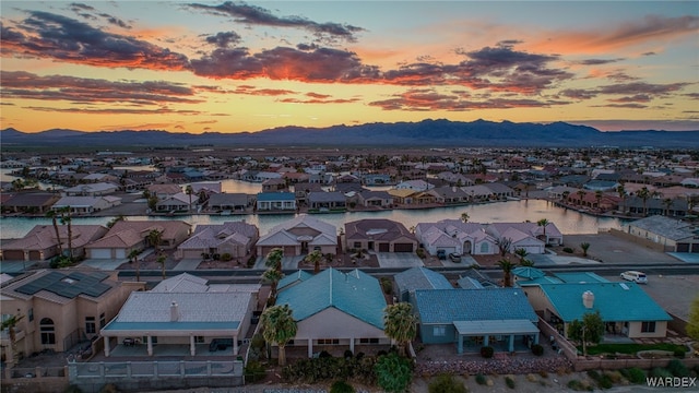 birds eye view of property with a mountain view and a residential view