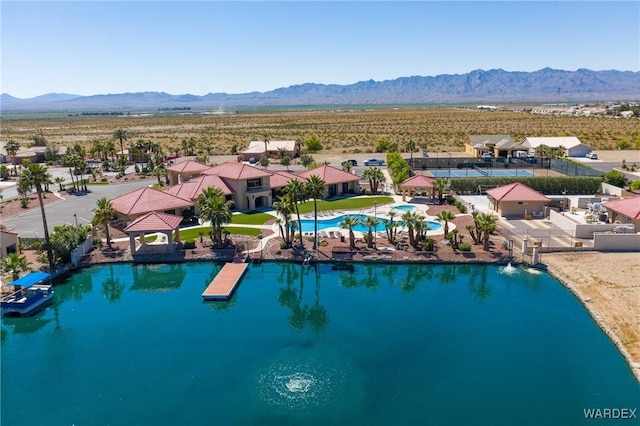 birds eye view of property featuring a water and mountain view