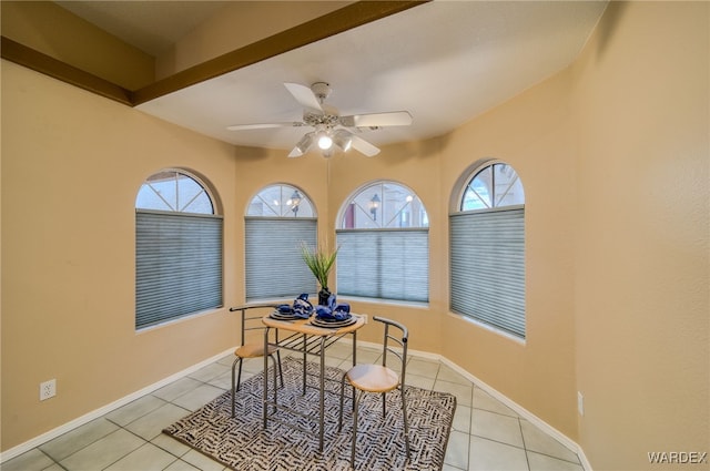 dining room featuring light tile patterned floors, baseboards, and a wealth of natural light