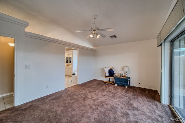 unfurnished room featuring tile patterned floors, visible vents, a ceiling fan, carpet floors, and baseboards