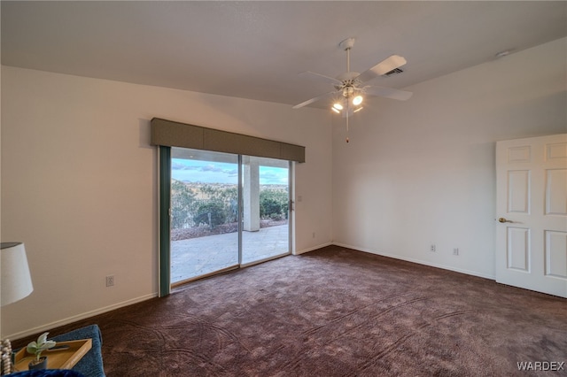 carpeted empty room featuring a ceiling fan, lofted ceiling, baseboards, and visible vents