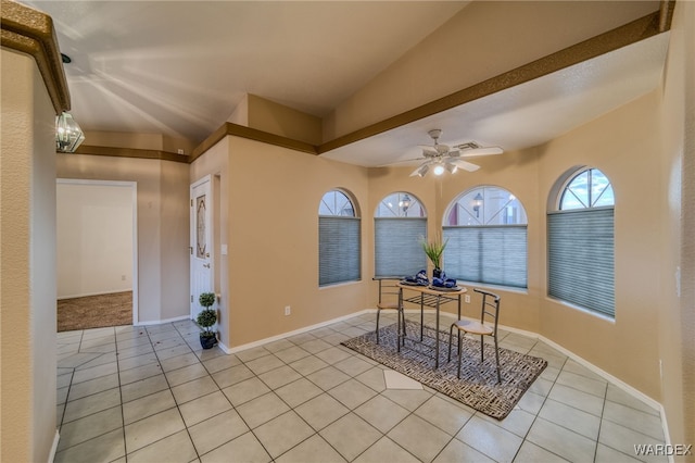 dining area featuring light tile patterned floors, baseboards, and ceiling fan