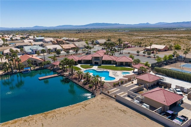 aerial view featuring a residential view and a water and mountain view