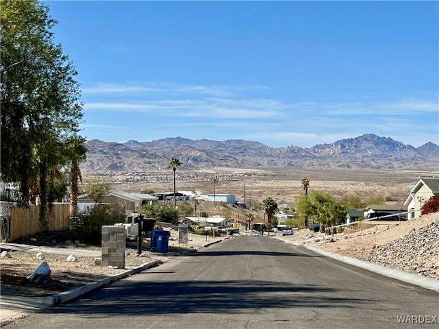 view of street featuring curbs and a mountain view