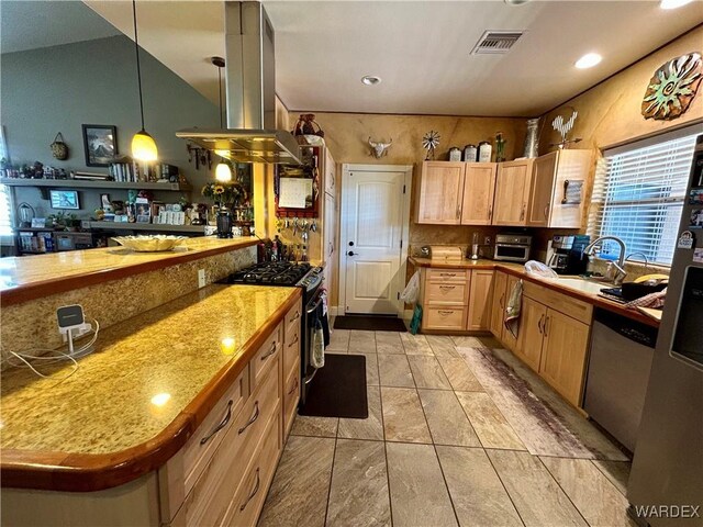 kitchen featuring stainless steel dishwasher, black gas stove, island range hood, light countertops, and hanging light fixtures