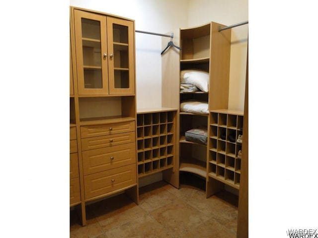 walk in closet featuring tile patterned flooring