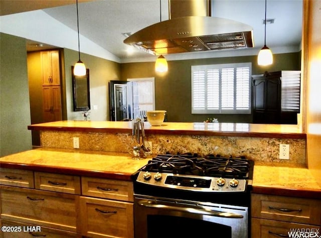 kitchen featuring brown cabinetry, visible vents, stainless steel gas range, and island range hood