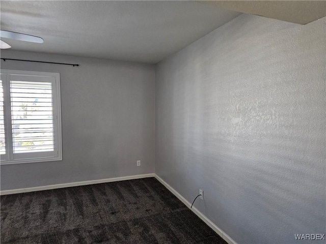 1800 Clubhouse Dr Unit 89, Bullhead City, AZ 86442 - spare room with baseboards, dark carpet, and ceiling fan