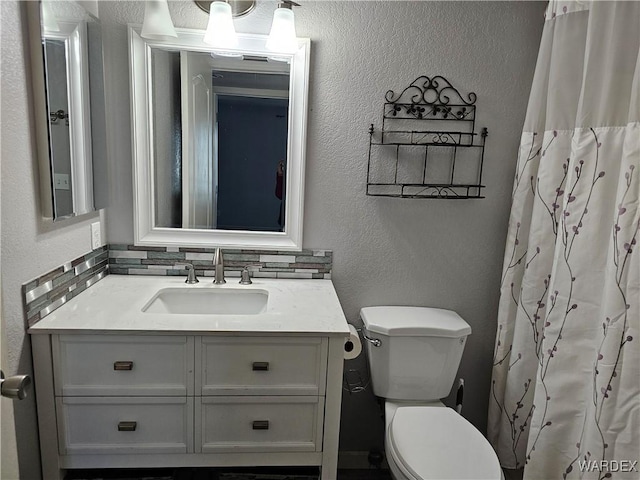 1800 Clubhouse Dr Unit 89, Bullhead City, AZ 86442 - full bath featuring toilet, a textured wall, backsplash, and vanity