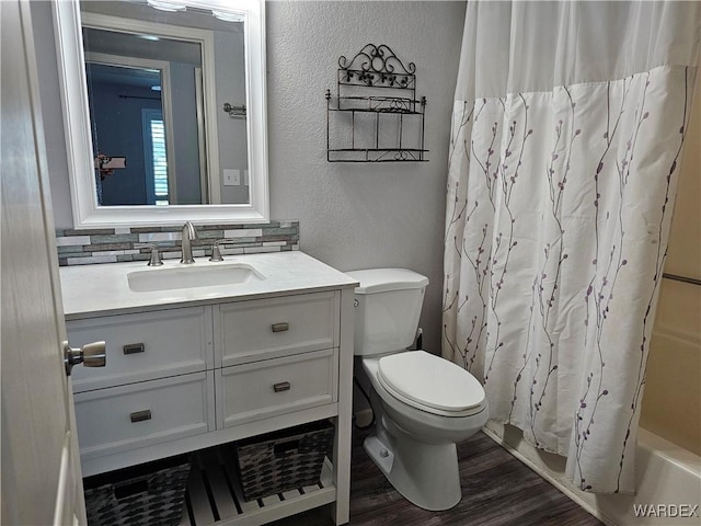 1800 Clubhouse Dr Unit 89, Bullhead City, AZ 86442 - full bathroom featuring vanity, toilet, wood finished floors, a textured wall, and backsplash