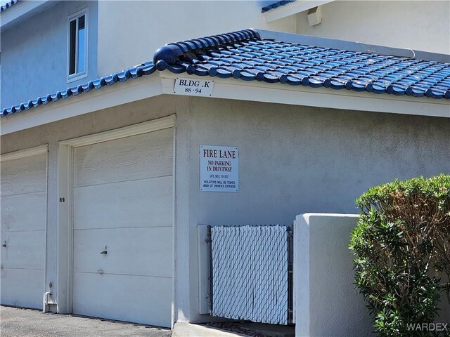 1800 Clubhouse Dr Unit 89, Bullhead City, AZ 86442 - exterior space with a tiled roof and stucco siding