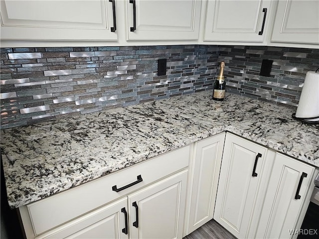 1800 Clubhouse Dr Unit 89, Bullhead City, AZ 86442 - details with white cabinetry, backsplash, and light stone countertops