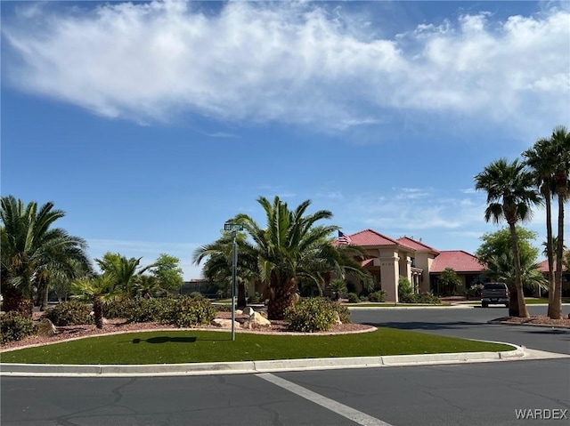 6052 S Bella Vista Dr, Fort Mohave, AZ 86426 - view of front facade featuring a front yard and stucco siding
