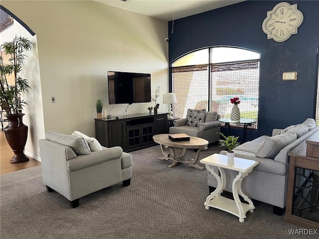 6052 S Bella Vista Dr, Fort Mohave, AZ 86426 - living area featuring arched walkways and carpet