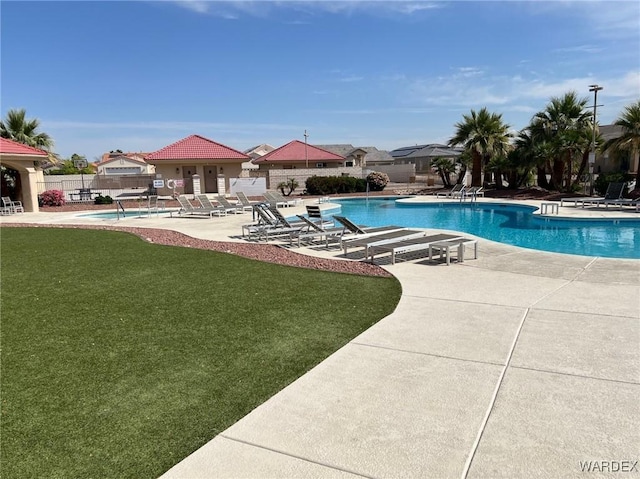 6052 S Bella Vista Dr, Fort Mohave, AZ 86426 - community pool with a yard, fence, and a patio area