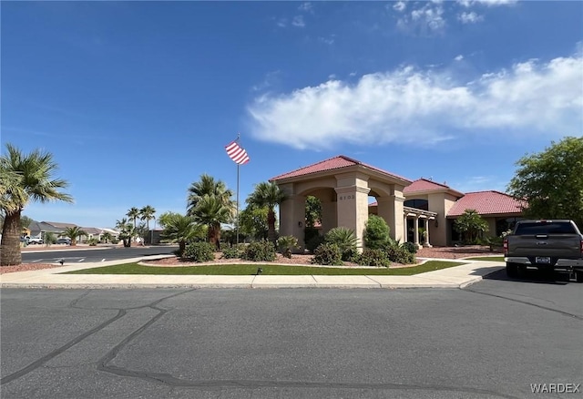 6052 S Bella Vista Dr, Fort Mohave, AZ 86426 - mediterranean / spanish-style home featuring a tiled roof and stucco siding