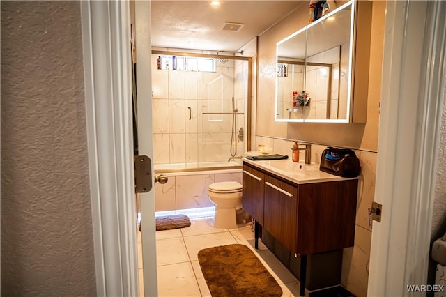 6052 S Bella Vista Dr, Fort Mohave, AZ 86426 - full bath with a textured wall, shower / tub combination, vanity, toilet, and visible vents