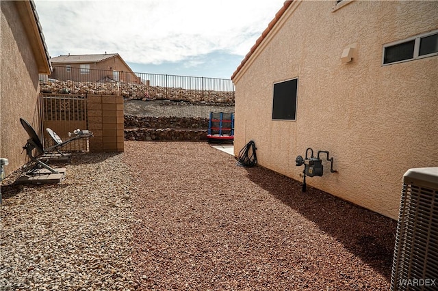 6052 S Bella Vista Dr, Fort Mohave, AZ 86426 - exterior space featuring central air condition unit and fence