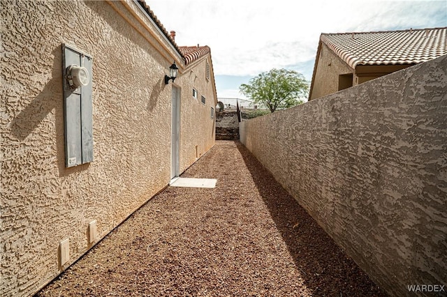 6052 S Bella Vista Dr, Fort Mohave, AZ 86426 - view of home's exterior featuring fence and stucco siding