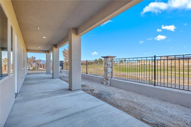 view of patio / terrace featuring fence