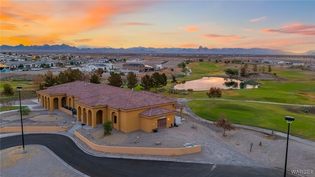 drone / aerial view featuring a residential view and a water and mountain view