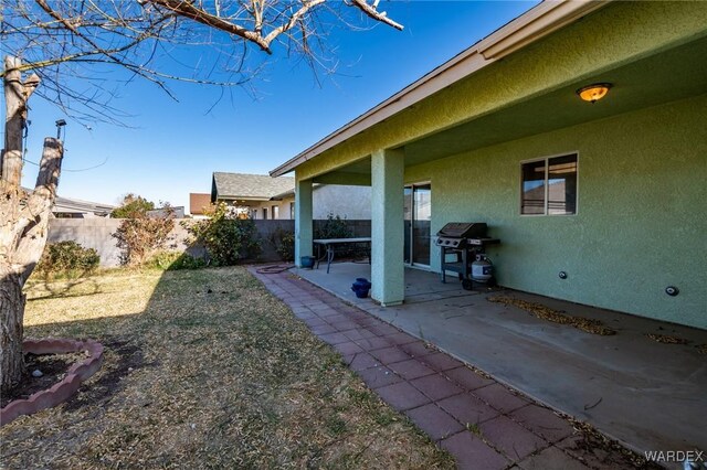 view of yard featuring a patio area and a fenced backyard