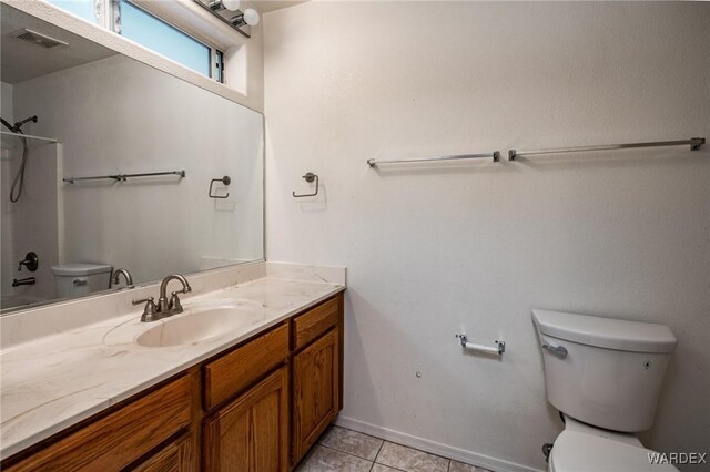 bathroom with visible vents, baseboards, toilet, tile patterned flooring, and vanity