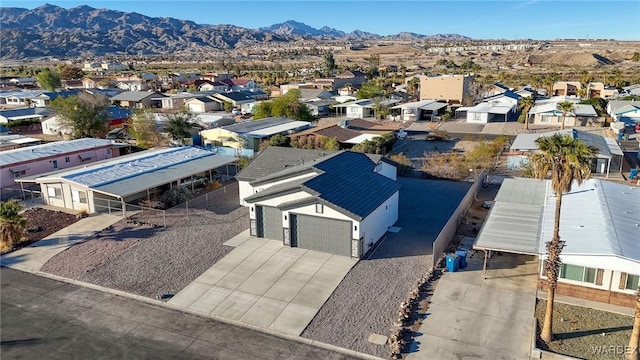 drone / aerial view with a residential view and a mountain view