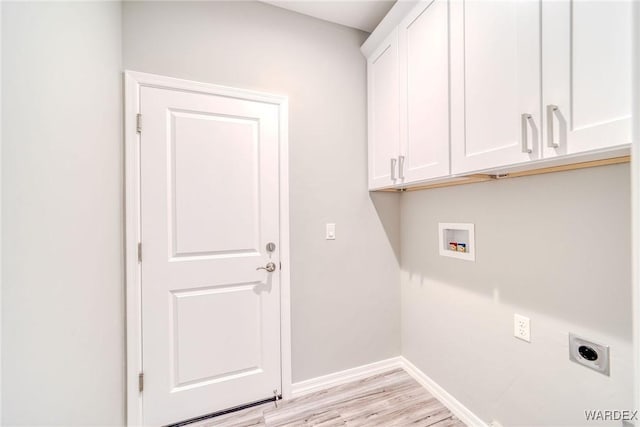 clothes washing area featuring cabinet space, baseboards, hookup for a washing machine, light wood-style floors, and electric dryer hookup