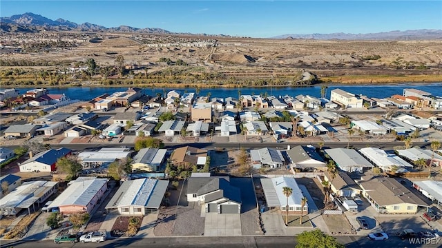 birds eye view of property with a residential view and a water and mountain view