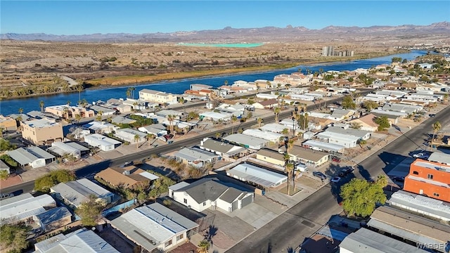 birds eye view of property with a residential view and a water and mountain view