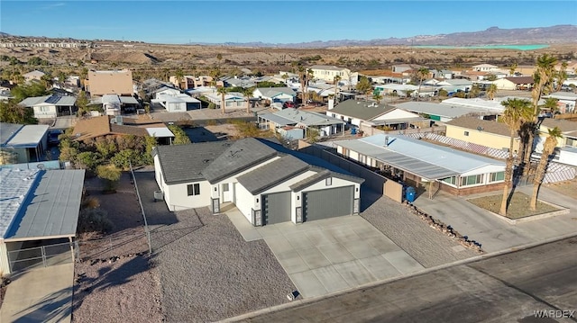 drone / aerial view with a residential view and a mountain view