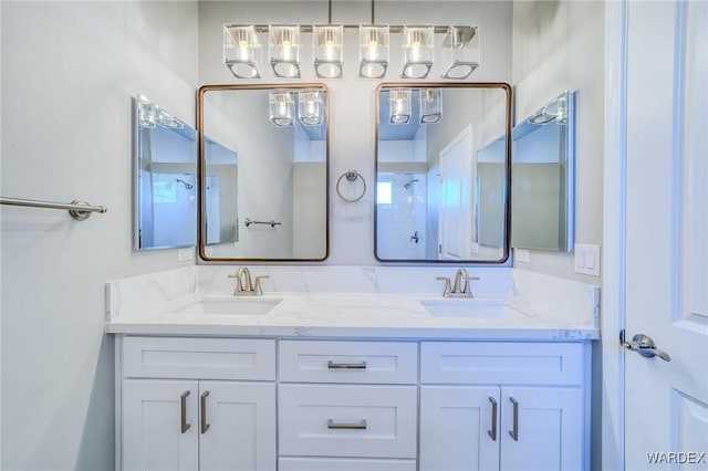 bathroom featuring double vanity and a sink