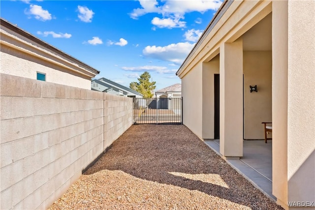 view of yard with a patio and fence