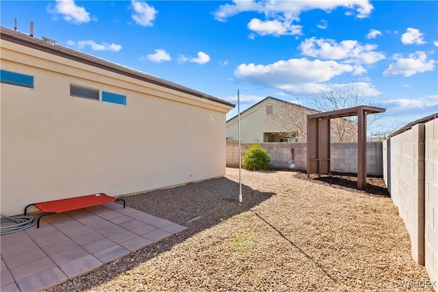 view of yard with a patio and a fenced backyard