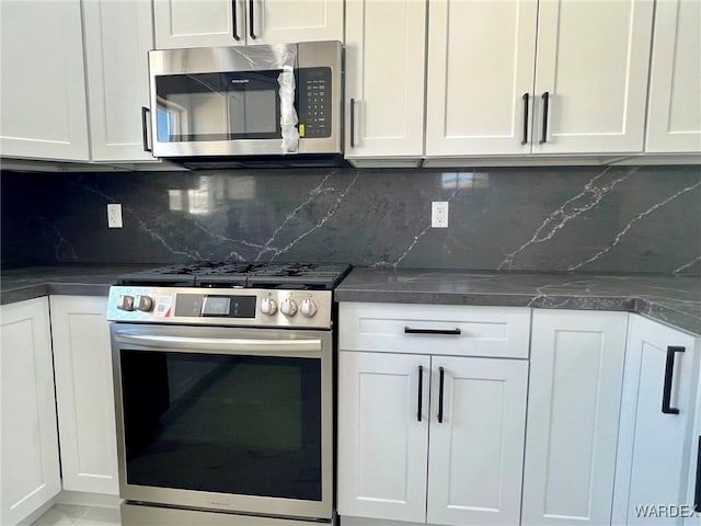 kitchen featuring white cabinetry and appliances with stainless steel finishes