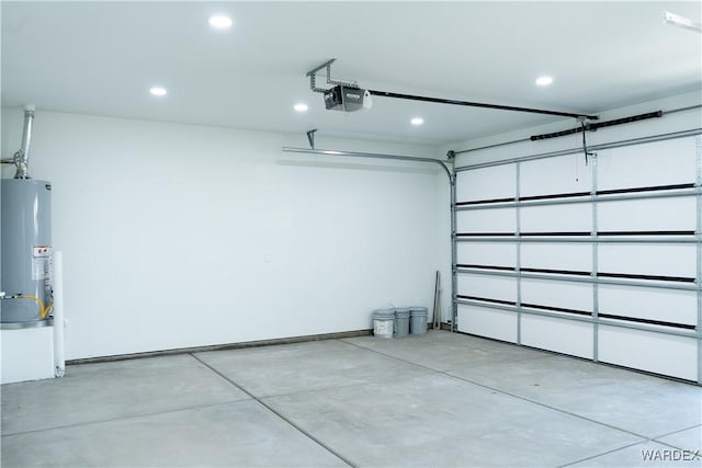 garage with water heater, recessed lighting, baseboards, and a garage door opener