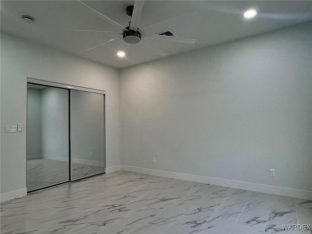 unfurnished bedroom featuring visible vents, baseboards, marble finish floor, a closet, and recessed lighting