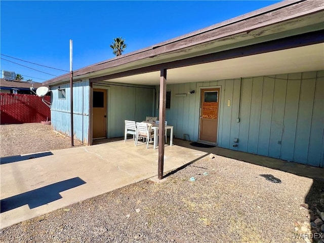 view of patio / terrace featuring fence